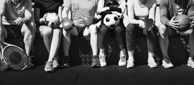 group-of-diverse-athletes-sitting-together (1)